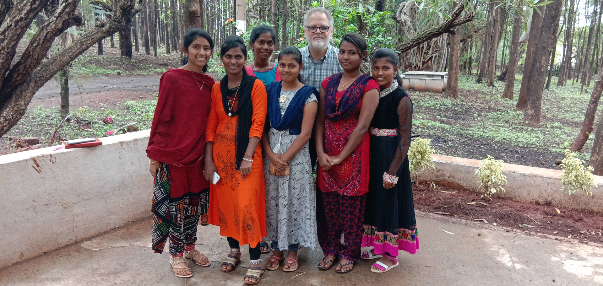Young women leaders with a mentor in the woods