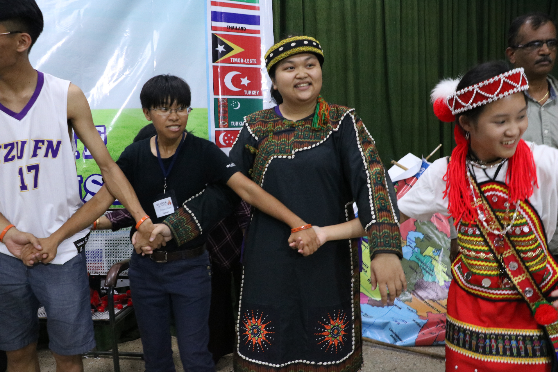 Delegates from across Asia standing hand in hand